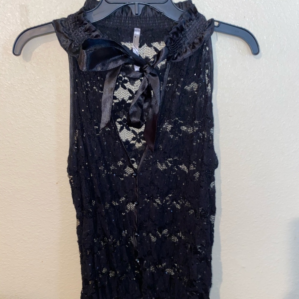 Mesh floral top with sparkles.